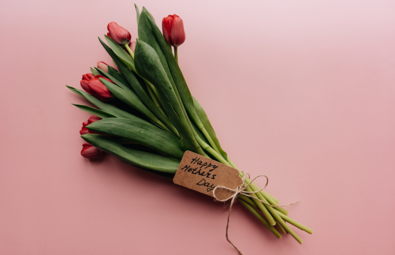 Bunch of pink tulips with a hand written Happy Mothers Day note