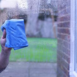 Window Cleaning with Blue Cloth